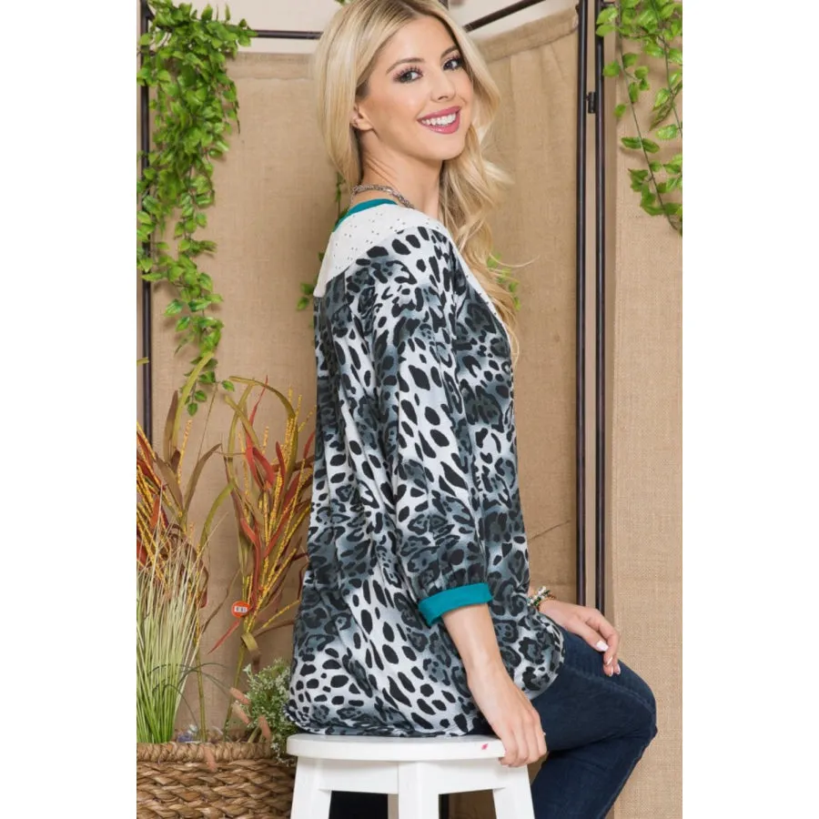 Celeste Full Size Animal Print Eyelet V-Neck Top