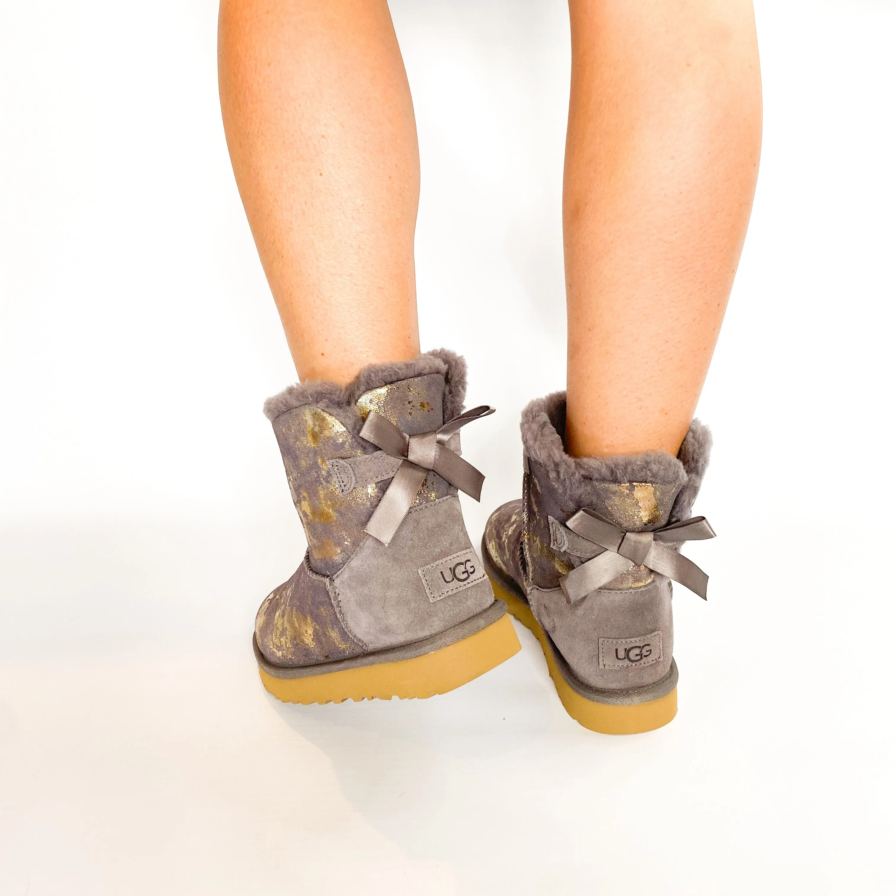 UGG grey mini bailey bow gold wash boot